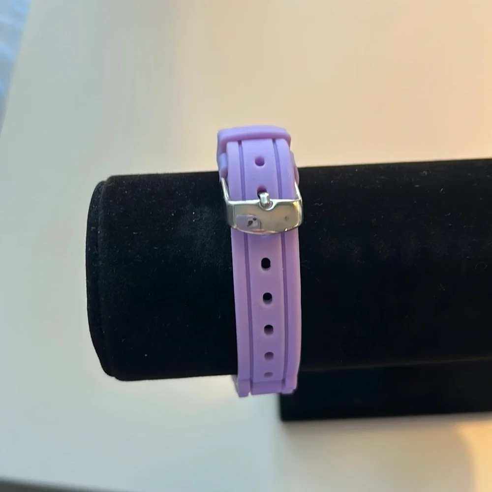 Purple watch with crystal face.